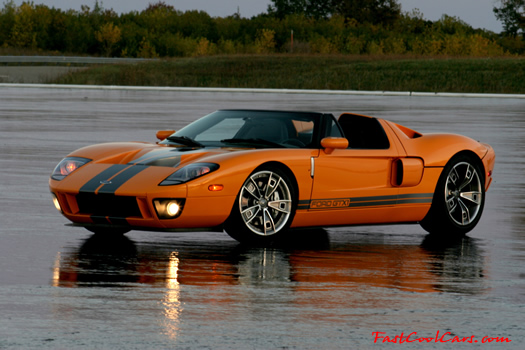 The 2005 Ford GTX1 - Gleaming orange paint with tungsten racing stripes. A removable hard-top aluminum roof. Custom designed forged modular wheels. And a 618-700 horsepower, 5.4L supercharged V-8 engine. 