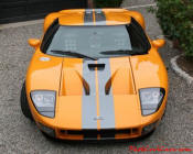 The 2005 Ford GTX1 - Gleaming orange paint with tungsten racing stripes. A removable hard-top aluminum roof. Custom designed forged modular wheels. And a 618-700 horsepower, 5.4L supercharged V-8 engine. 