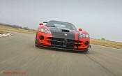 2009 Dodge Viper ACR - You're looking at Dodge's answer to the Porsche 911 GT3 RS or Lotus Exige, a road car you can drive to the track, hot lap all day, and drive back home, tires, brakes, and ego intact. The Viper ACR is raw. It's wired. And it's probably the best weekend racer yet from Detroit.