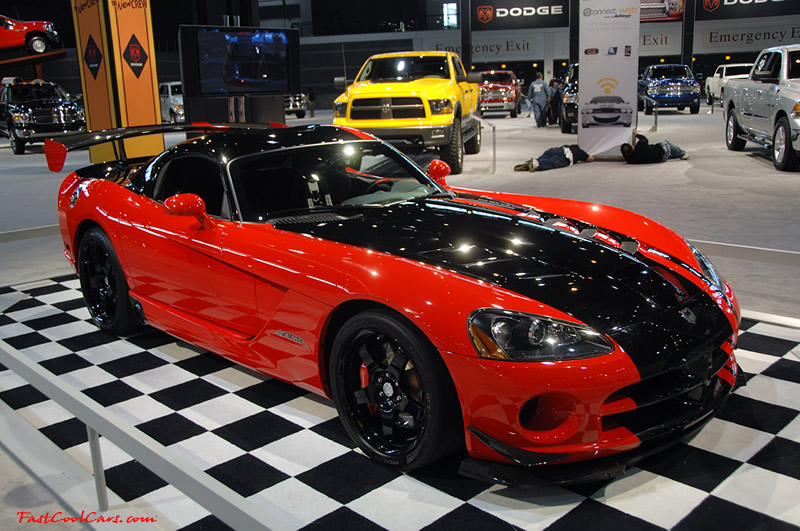 2009 Dodge Viper ACR - You're looking at Dodge's answer to the Porsche 911 GT3 RS or Lotus Exige, a road car you can drive to the track, hot lap all day, and drive back home, tires, brakes, and ego intact. The Viper ACR is raw. It's wired. And it's probably the best weekend racer yet from Detroit.