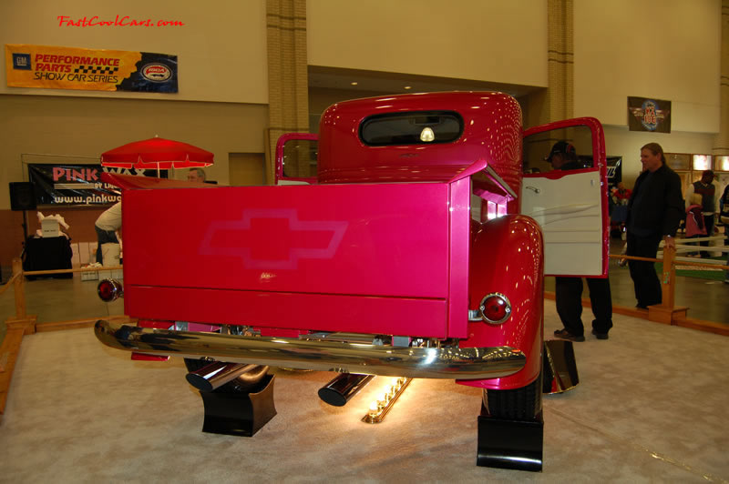 The 2009 World of Wheels Show in Chattanooga, Tennessee. On Jan. 9th,10, & 11th, Pictures by Ron Landry. Killer custom paint job on this pickup, Pink too. See the Chevrolet Bowtie emblem in the tailgate paint.