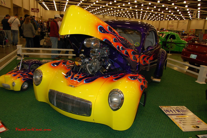 The 2009 World of Wheels Show in Chattanooga, Tennessee. On Jan. 9th,10, & 11th, Pictures by Ron Landry. That is a HUGE engine, and sweet paint job. And look at the mini ride beside it...LOL