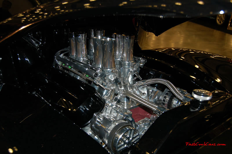 The 2009 World of Wheels Show in Chattanooga, Tennessee. On Jan. 9th,10, & 11th, Pictures by Ron Landry. Looks like 8 seperate fuel injectors velocity stacks, looks killer in the street rod. Wild ride.