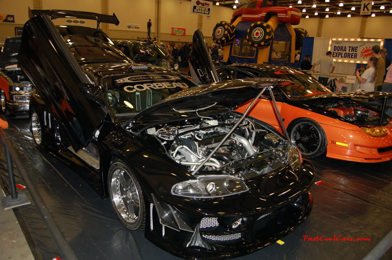 The 2009 World of Wheels Show in Chattanooga, Tennessee. On Jan. 9th,10, & 11th, Pictures by Ron Landry. Import with lambo doors and lots of wire wrapping under the hood. and a body kit to boot.