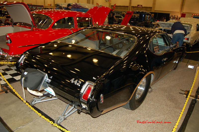 The 2009 World of Wheels Show in Chattanooga, Tennessee. On Jan. 9th,10, & 11th, Pictures by Ron Landry. One fast cool Oldsmobile 442, and with a roll cage and wheelie bars and a parachute,... must be fast. ;)