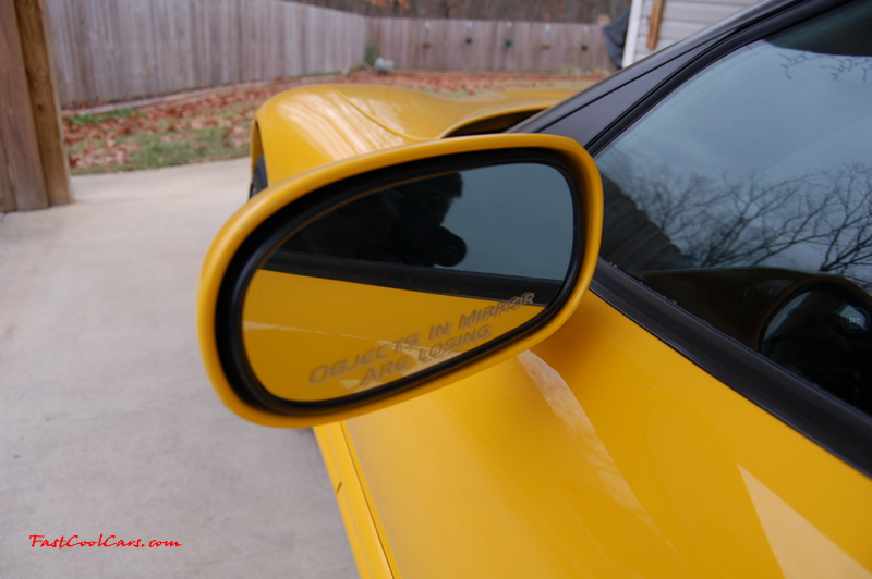 2002 Millennium Yellow Z06 Corvette - 405 HP Stock, at new home in Cleveland, Tennessee, with decal on drivers side mirror that reads "Objects in Mirror are Losing".