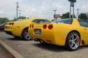 2010 Chevrolet Camaro 2LT and a 2002 supercharged Z06 Corvette, both in Yellow.