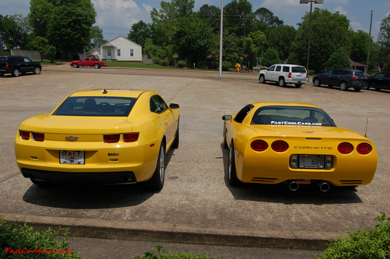 2010 Chevrolet Camaro 2LT and 2002 Supercharged Z06 Corvette, both in yellow.