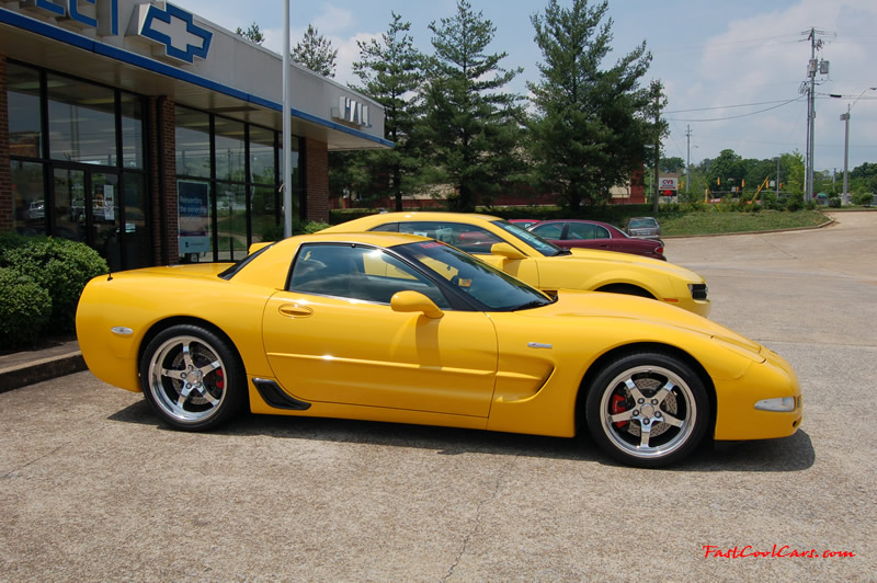 2010 Chevrolet Camaro 2LT and 2002 Supercharged Z06 Corvette, both in yellow.