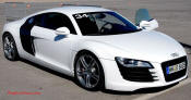 Audi R8 Designed to compete against the Porsche 911, the new Audi R8 features quattro permanent four-wheel drive, space frame aluminum body and the mid-mounted 420 bhp V8 FSI engine, and lots of carbon fiber.