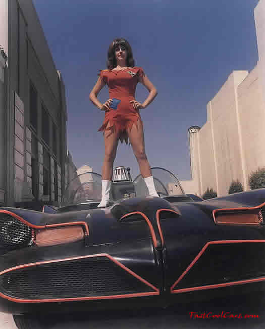 The Original Batmobile from the series in 1966-68 TV series with girl standing on batmobile