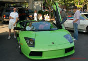 Ron Landry next to a Lime Green Lamborghini Gallardo at the Cleveland TN monthly car shows and events with hot rods, muscle cars, famous cars, rare cars, wild cars, fast cars, cool cars, rat rods, supercharged cars, new whips, and much more.