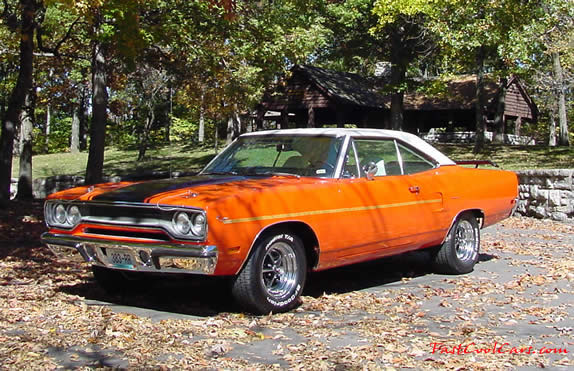 1970 Plymouth Road Runner - It is Tor-Red exterior, with a white vinyl top and interior