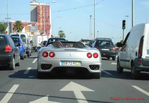 Very Fast Cool Exotic Supercar, in the converible in traffic