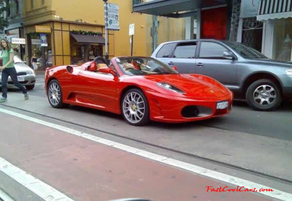 Very Fast Cool Exotic Supercar red Ferrari convertible.