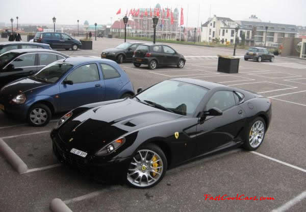Very Fast Cool Exotic Supercar, black Ferrari, and check out the cool yellow big brakes on it too.