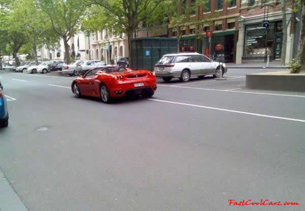 Very Fast Cool Exotic Supercar red Ferrari roadster.