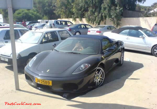 Very Fast Cool Exotic Supercar, Ferrari with not so good parking skills, so it seems.