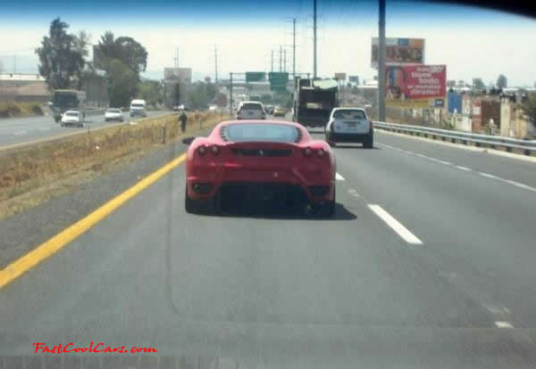 Very Fast Cool Exotic Supercar, red Ferrari on the highway.
