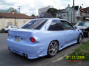 1994 Ford Escort with Honda body kit Corvette tail lights, and more.