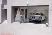 Applying the garage door decal to the garage door.