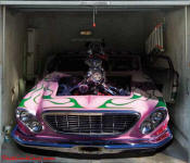 Custom painted tricked out blown car, on garage door decal.