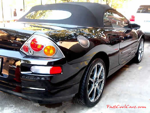 2003 Black Mitsubishi Eclipse Spyder convertible, with killer wheels, customized.