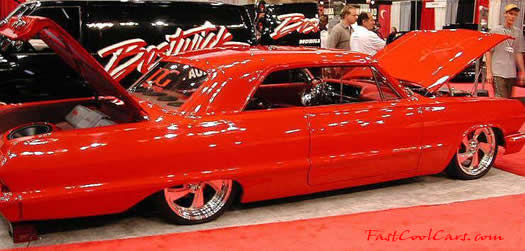 Lowrider Impala that has been lowered, dropped, slammed, and scraping, using many different modifications.