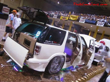 Lowrider Blazer that has been lowered, dropped, slammed, and scraping, using many different modifications.