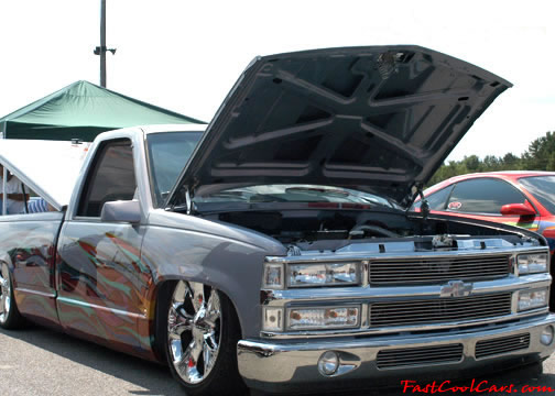 Lowriders that have been lowered, dropped, slammed, and scraping. Nice truck.