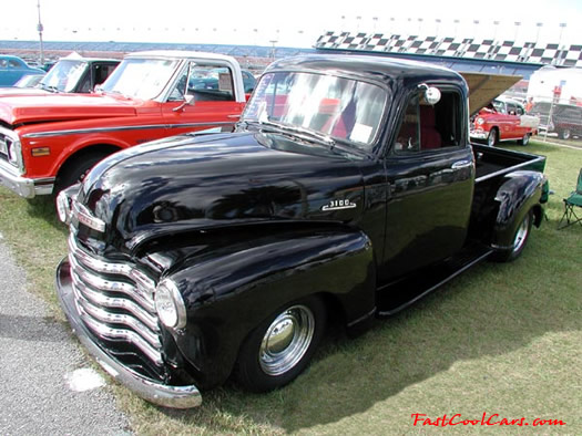 Lowriders that have been lowered, dropped, slammed, and scraping. Classic truck.
