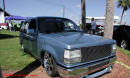 Lowriders that have been lowered, dropped, slammed, and scraping. Pick-up truck.