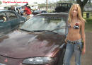 Lowriders that have been lowered, dropped, slammed, and scraping. Pretty young lady.