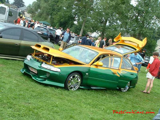 Lowriders that have been lowered, dropped, slammed, and scraping. Nice body kit, and killer hood.