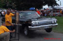 Lowriders that have been lowered, dropped, slammed, and scraping. Hydraulic bouncing height contest.