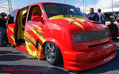 Lowriders that have been lowered, dropped, slammed, and scraping. Vans can be cool.