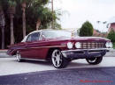 Lowriders that have been lowered, dropped, slammed, and scraping. Classic American car.