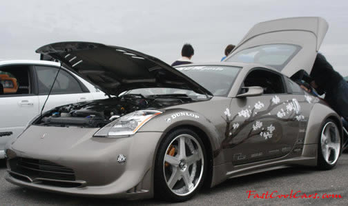Lowriders that have been lowered, dropped, slammed, and scraping. Nissan 350Z, cool.