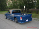 Lowriders that have been lowered, dropped, slammed, and scraping. Low rider truck and cowl hood, and rear spoiler, sweet.