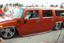 Lowriders that have been lowered, dropped, slammed, and scraping. Hummer on the ground.