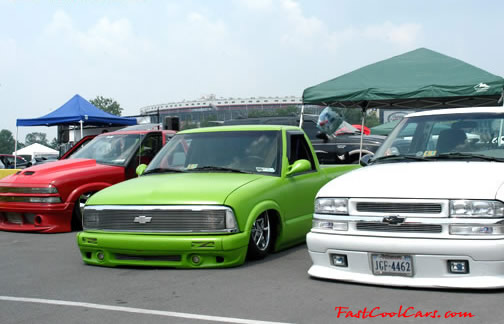 Lowriders that have been lowered, dropped, slammed, and scraping. On the ground lowrider trucks.