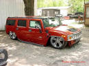 Lowriders that have been lowered, dropped, slammed, and scraping. On the ground Hummer.