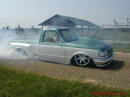 Lowriders that have been lowered, dropped, slammed, and scraping. Low rider truck doing burnout.