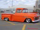 Lowriders that have been lowered, dropped, slammed, and scraping. Classic American Low rider truck, sweet color paint.