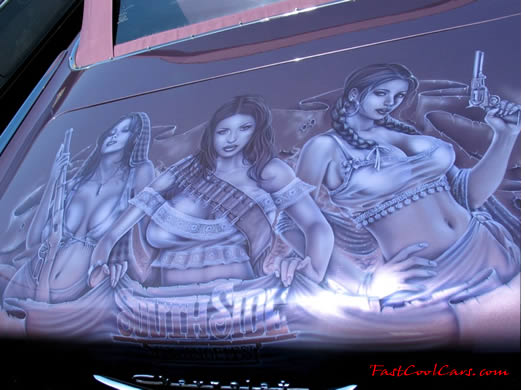 Lowriders that have been lowered, dropped, slammed, and scraping, using many different modifications. Awesome mural