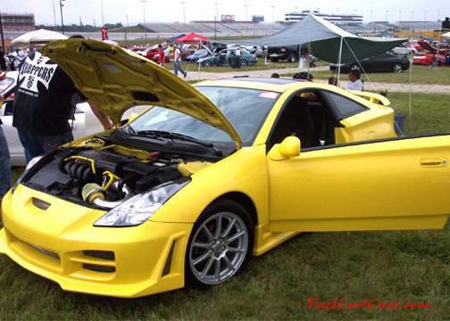 Lowriders that have been lowered, dropped, slammed, and scraping, using many different modifications. Cool yellow paint