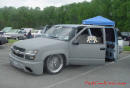 Lowriders that have been lowered, dropped, slammed, and scraping, using many different modifications. Pick-up truck.