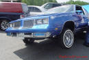 Lowriders that have been lowered, dropped, slammed, and scraping, using many different modifications.