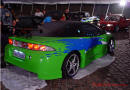 Lowriders that have been lowered, dropped, slammed, and scraping, Eclipse in lime green.