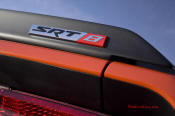New Dodge Challenger, 6.1 V8 Hemi, 425 crank horsepower, 420 crank foot pounds of torque. SRT8 badge.